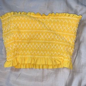 Yellow swimsuit top.